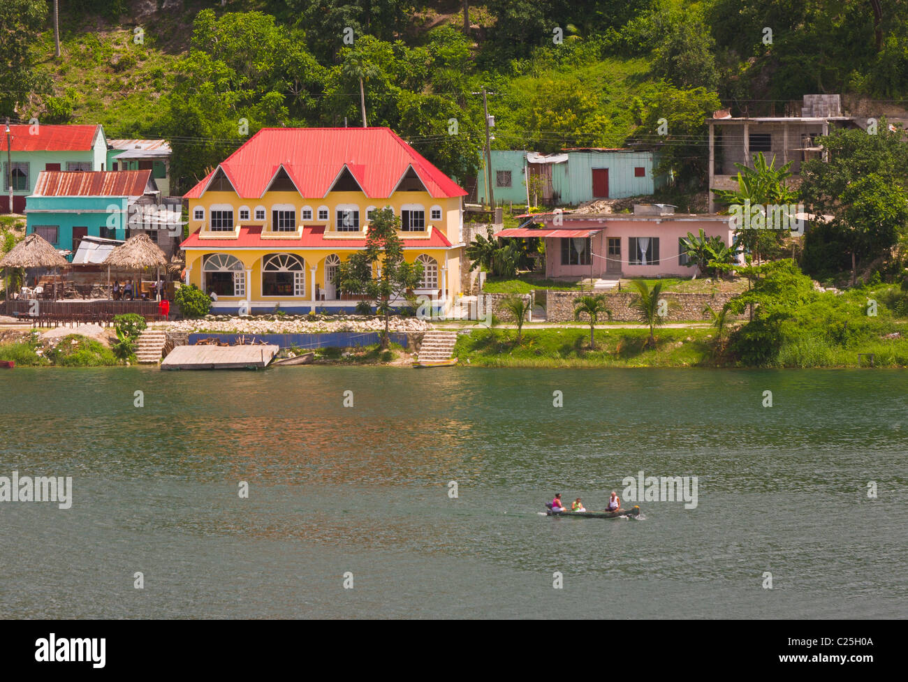 FLORES, GUATEMALA - Colorful buildings on the shore of Lago Peten Itza, near the colonial town of Flores. Stock Photo