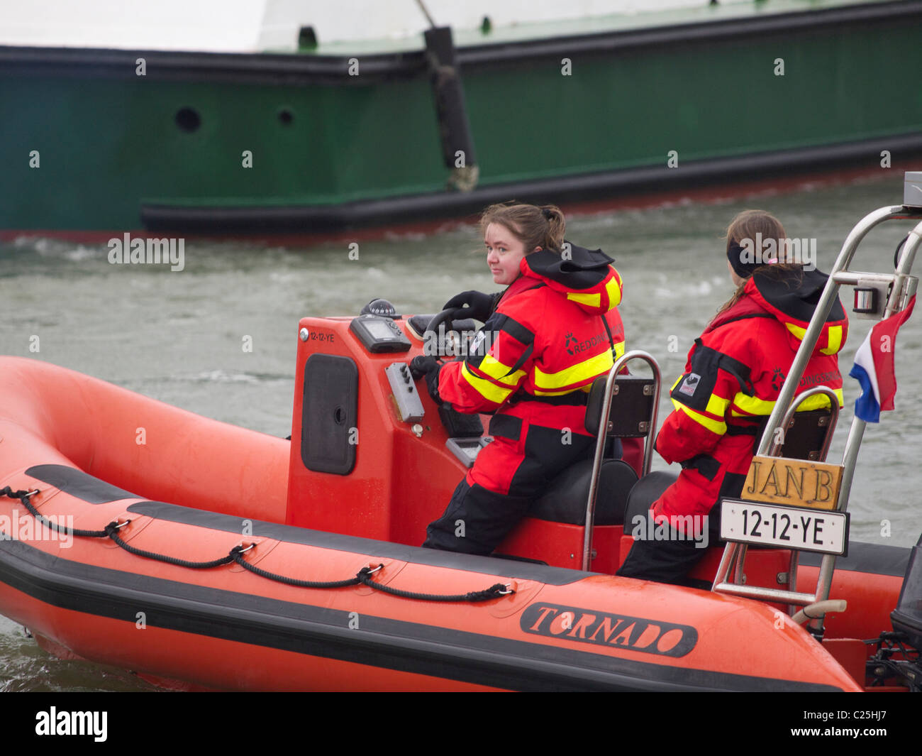 women in a typically male profession, offshore rescuers in this case. Stock Photo