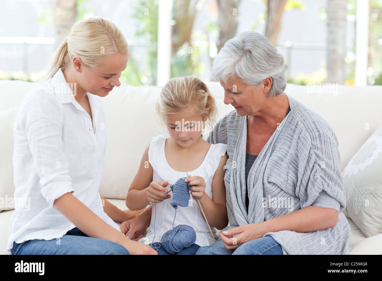 Family knitting together at home Stock Photo Alamy