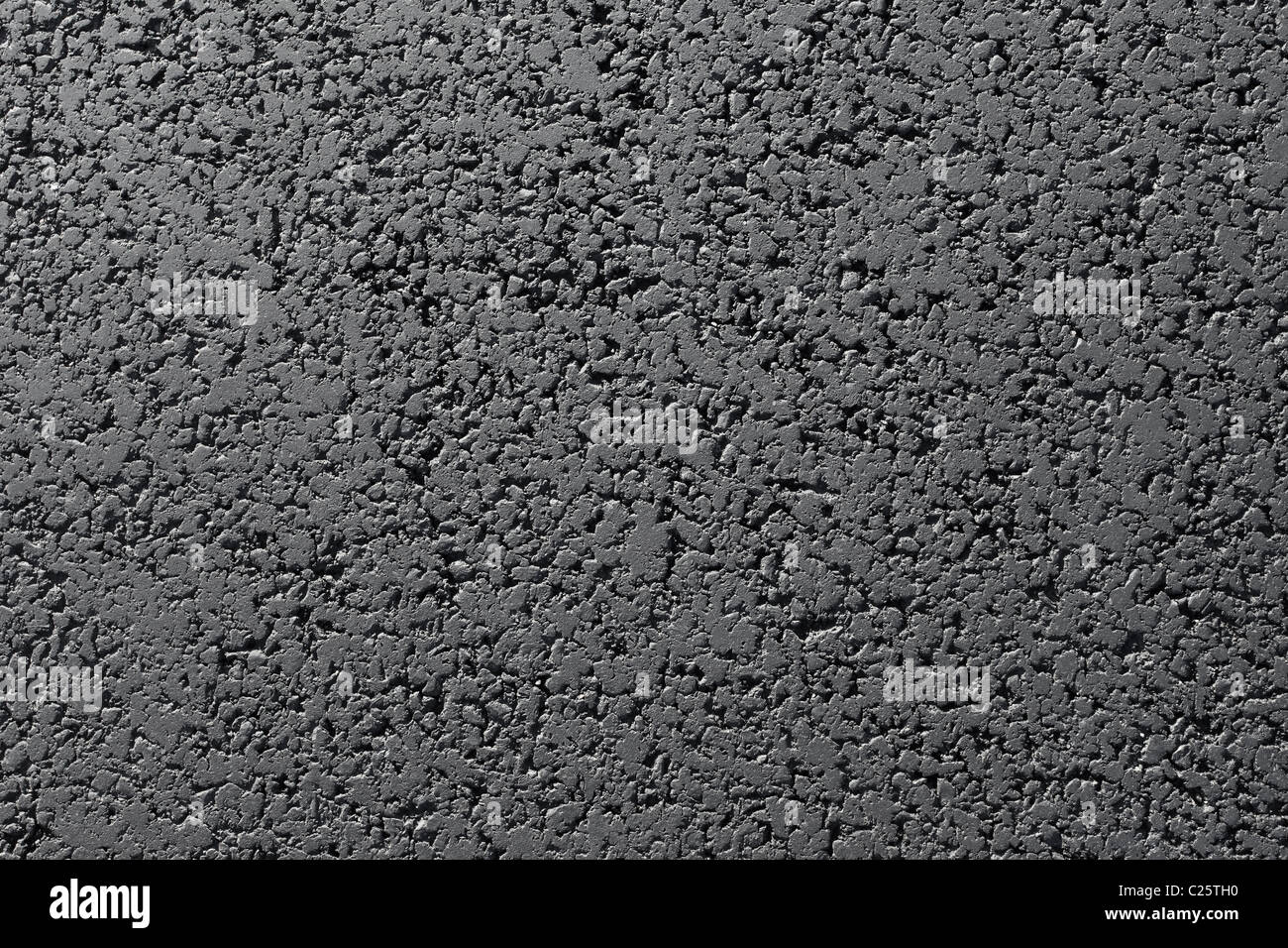 New black tarmac road surface close up abstract texture background. Stock Photo