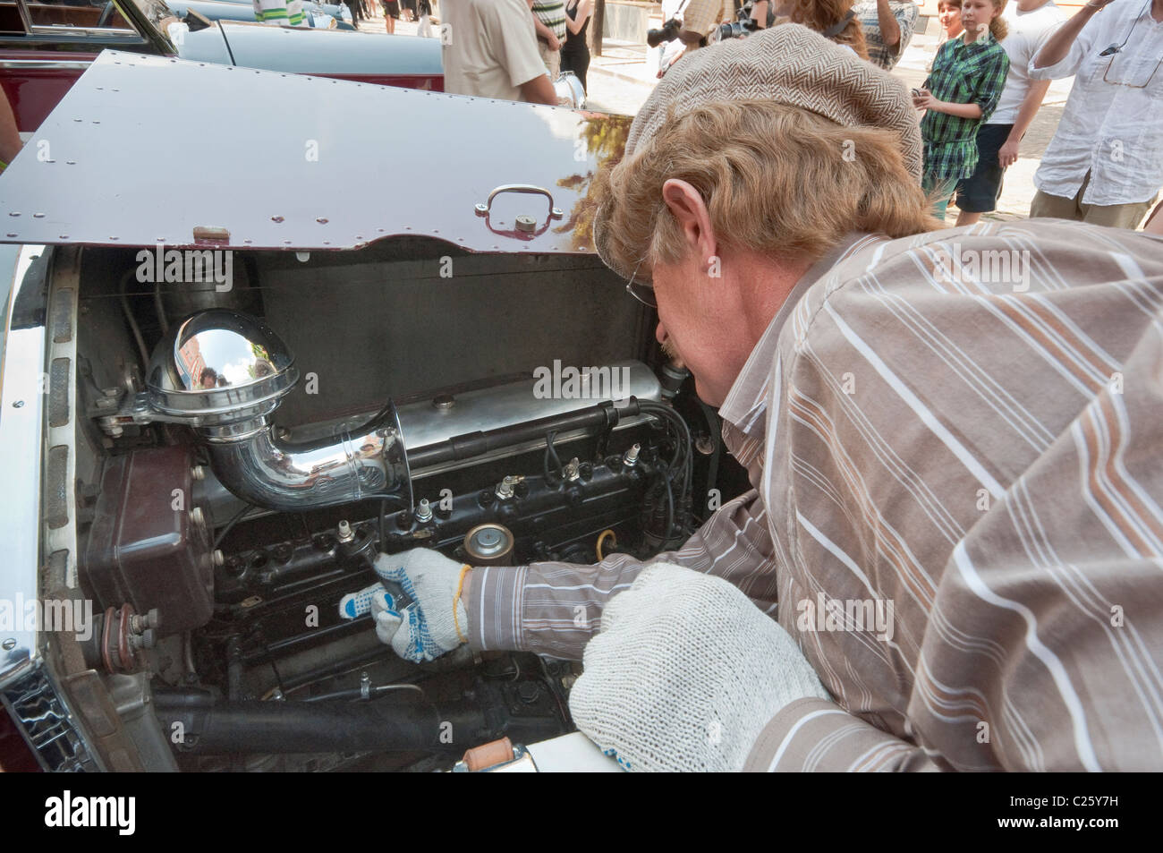 Owner checking engine of his 1927 Rolls-Royce Twenty 20HP at Rolls-Royce & Bentley Club meeting in Świdnica, Silesia, Poland Stock Photo
