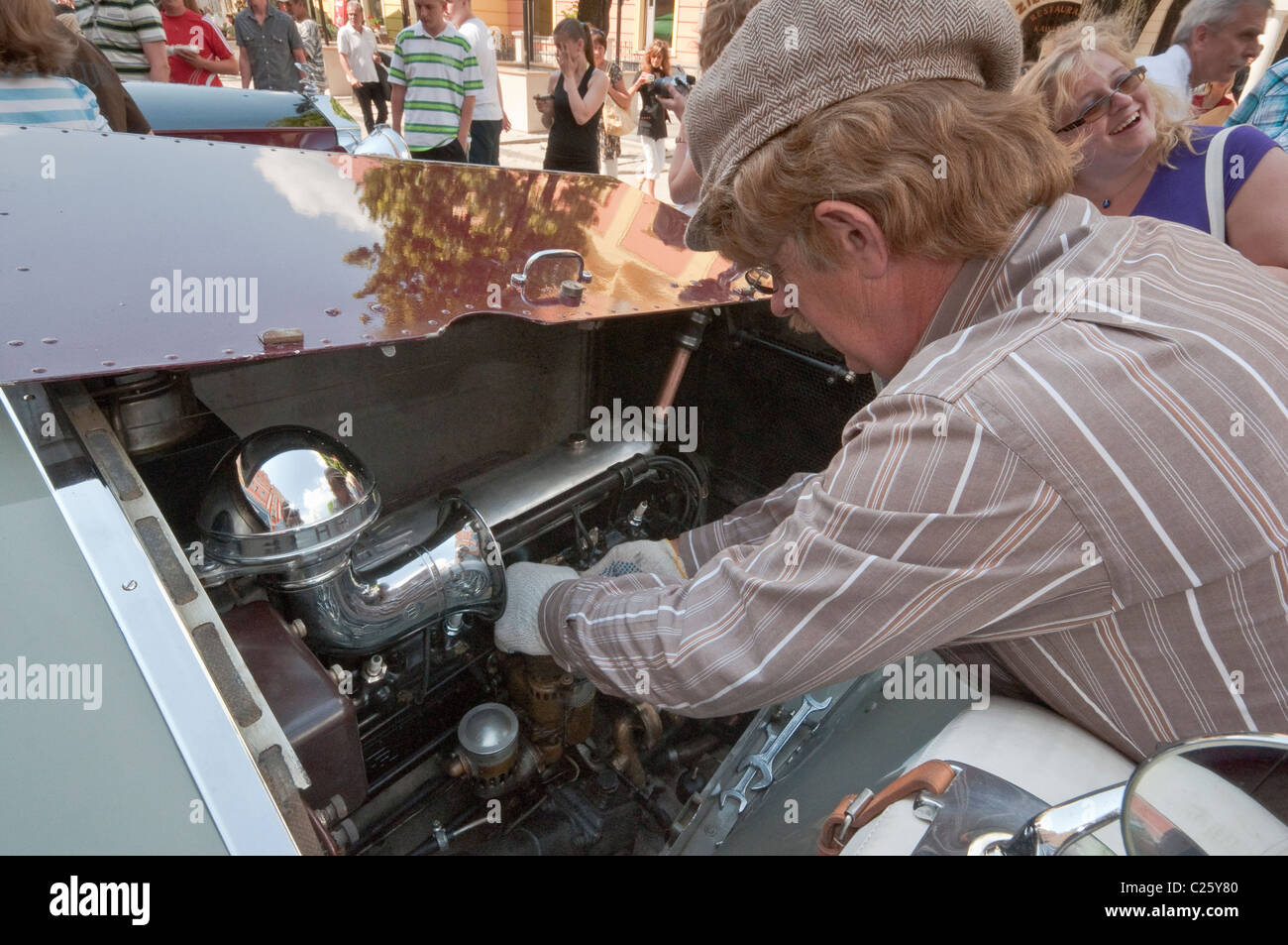 Owner checking engine of his 1927 Rolls-Royce Twenty 20HP at Rolls-Royce & Bentley Club meeting in Świdnica, Silesia, Poland Stock Photo