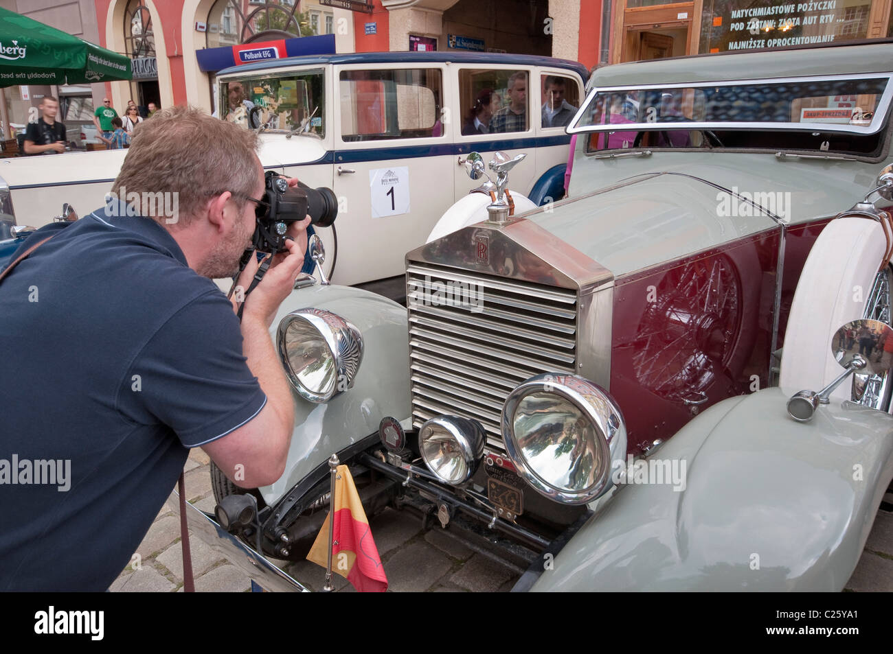 Taking pictures of The Spirit of Ecstasy mascot on 1927 Rolls-Royce Twenty 20HP at R-R Club meeting, Świdnica, Silesia, Poland Stock Photo