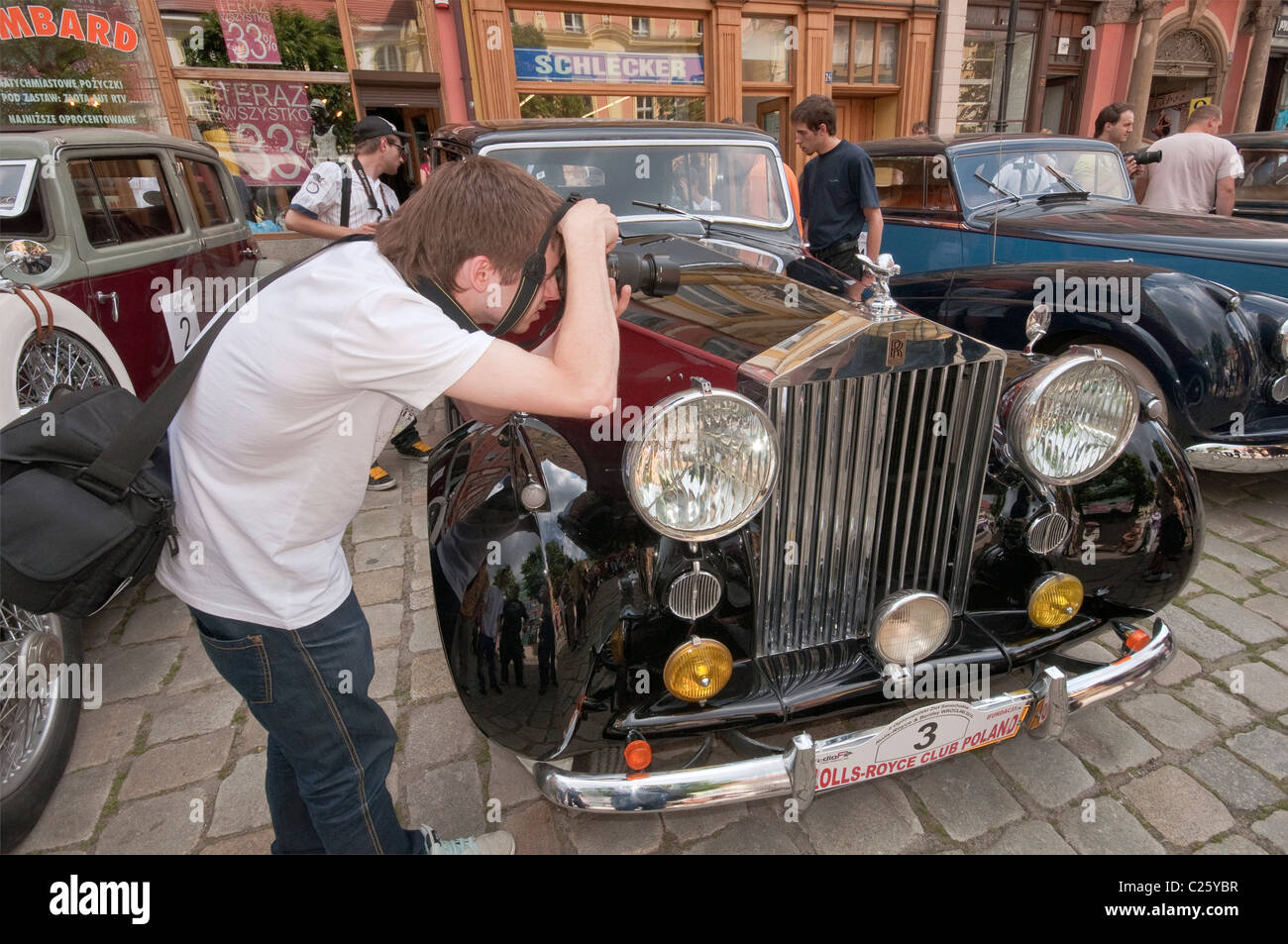 Taking pictures of The Spirit of Ecstasy mascot on 1948 Rolls-Royce Silver Wraith at R-R Club meeting, Świdnica, Silesia, Poland Stock Photo