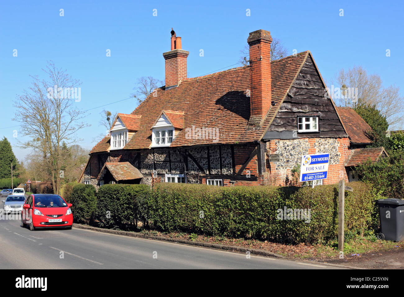 Old country house on road for sale Surrey England UK Stock Photo Alamy