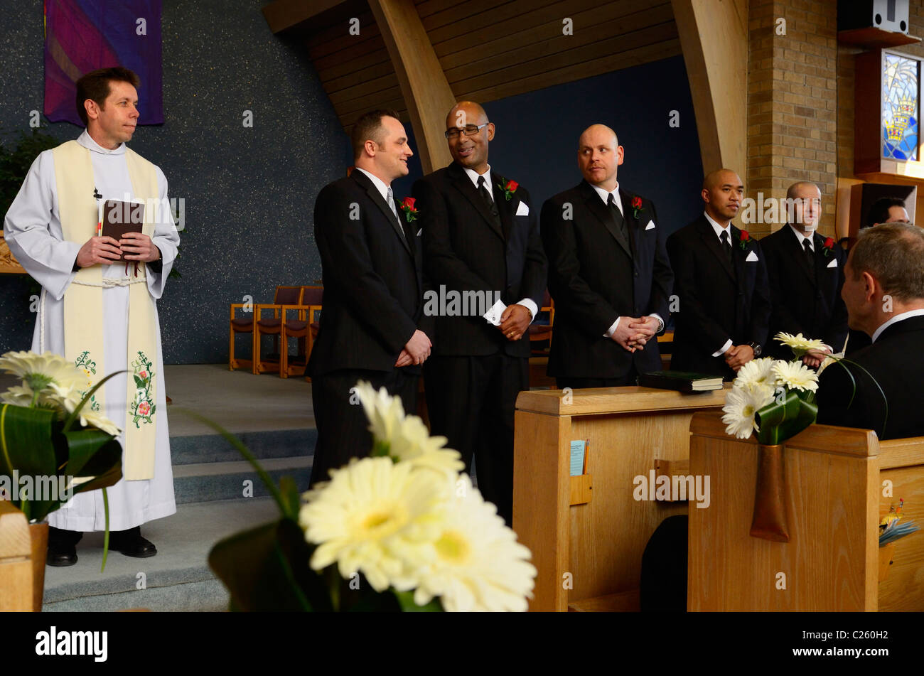 Groom and Groomsmen waiting for the bride in a church before a wedding