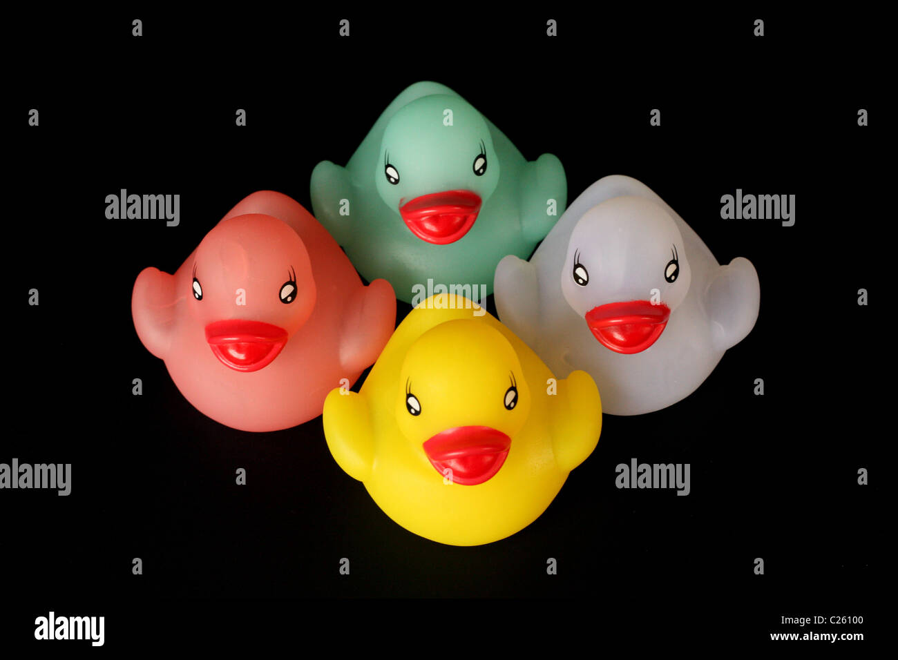 Toy rubber ducks on black background Stock Photo