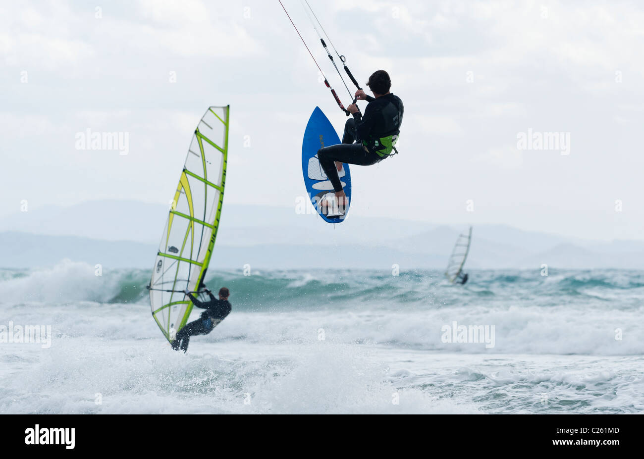 Kitesurfer jumping over the sea. Stock Photo