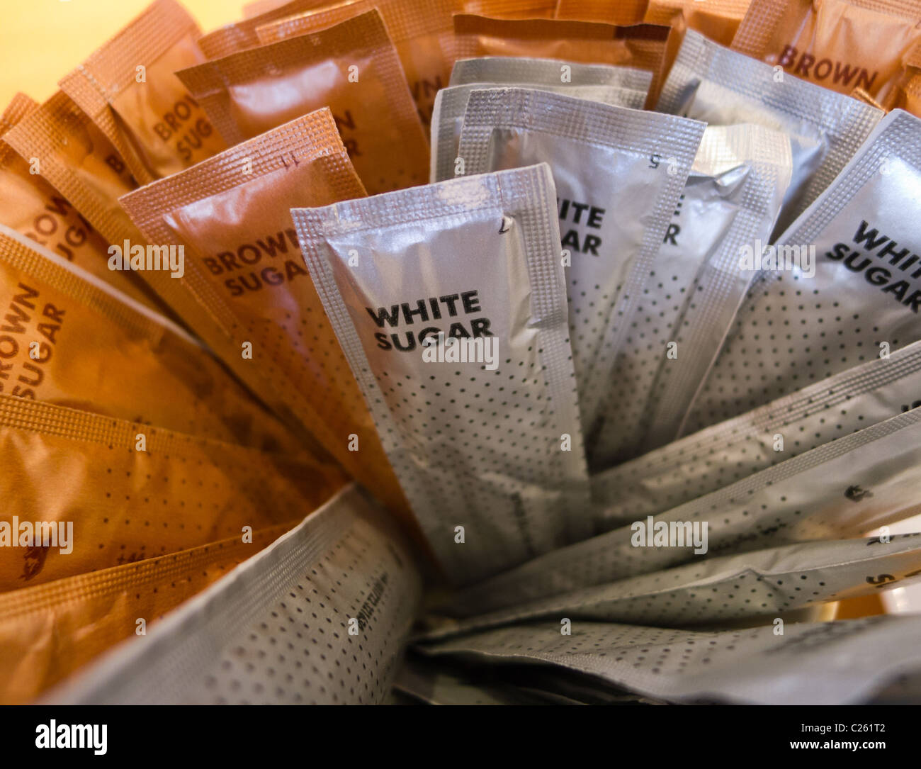 White and brown sugar sachets Stock Photo