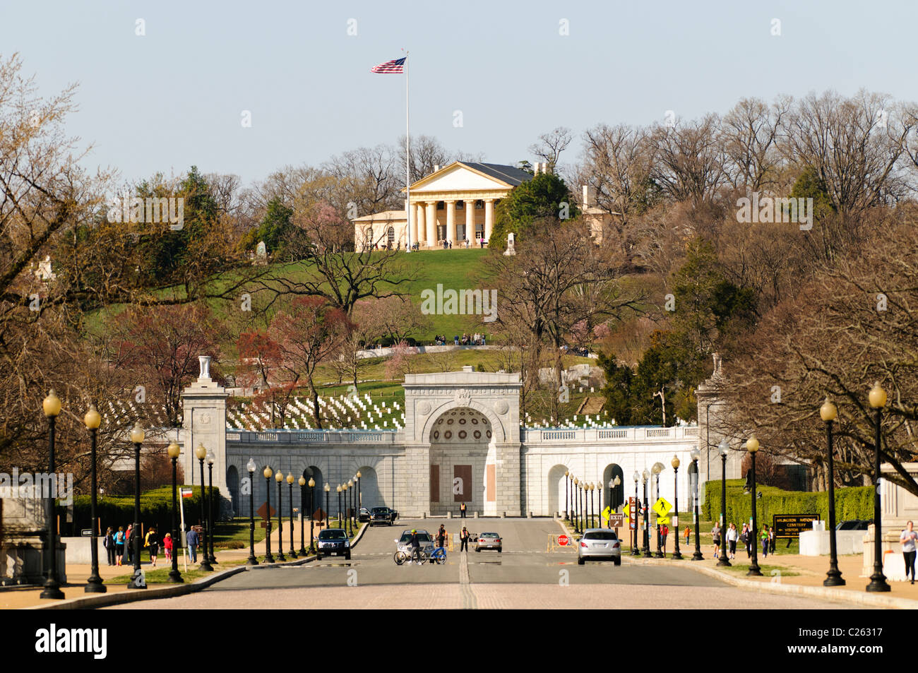 Arlington House, also known as the Robert E. Lee Memorial on top of the hill of Arlington National Cemetery. The shot is taken from Memorial Bridge looking west. In the foreground is the entrance of the cemetery with the John F. Kennedy gravesite directly behind that. Stock Photo