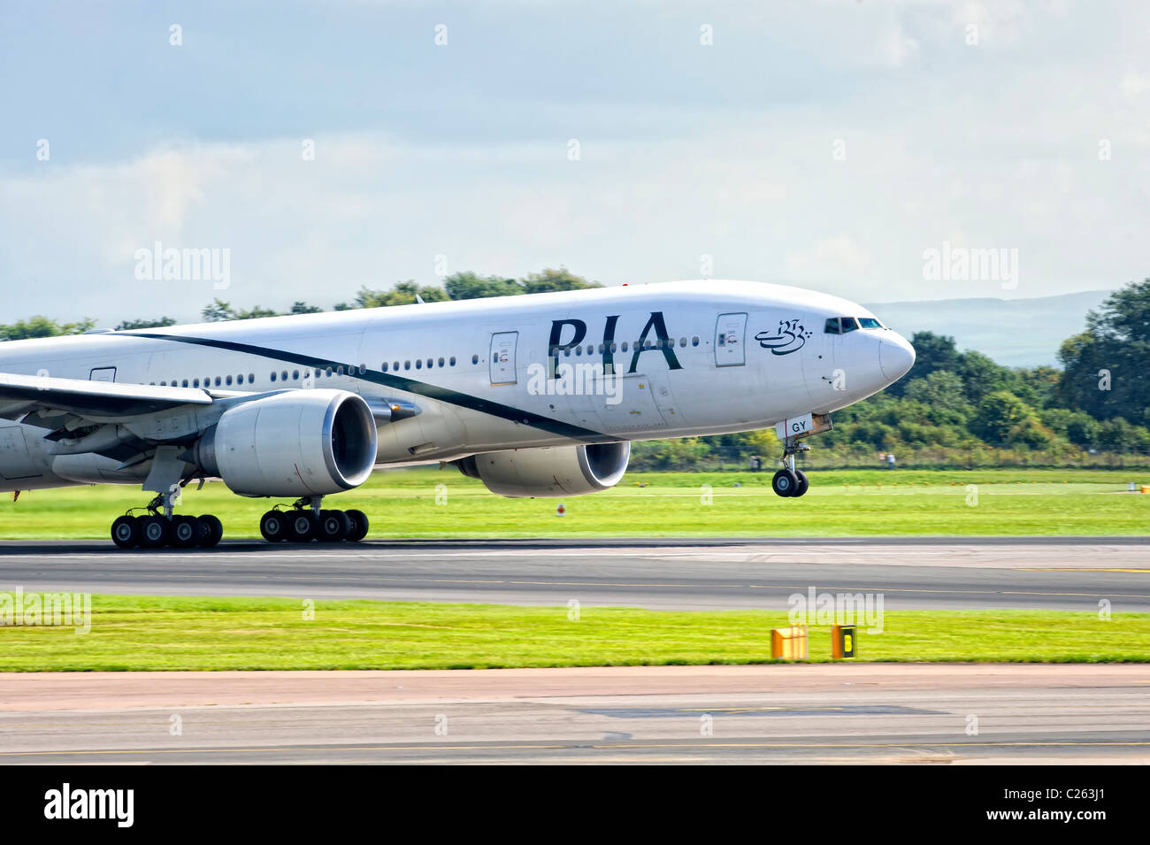 Pakistan International Airways (PIA) aircraft taking off from Manchester Airport Stock Photo
