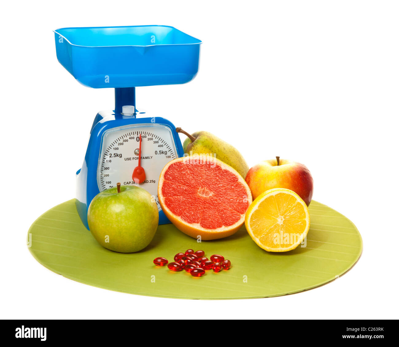 A lot of different fruits, pills and scale Stock Photo