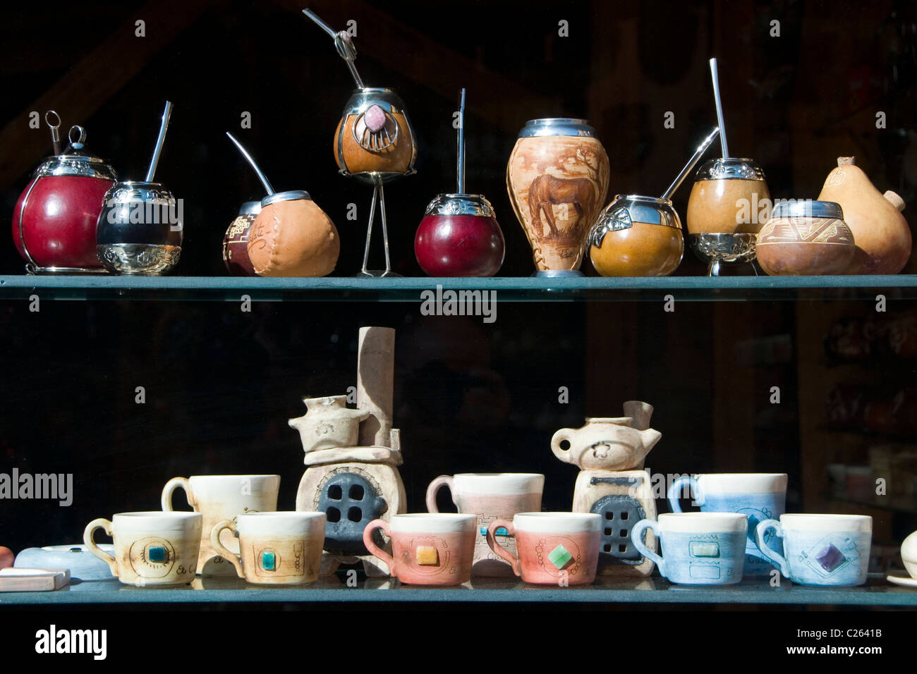 Mate gourds with bombilla and coffee mugs in a craft shop in El Calafate, Patagonia Stock Photo