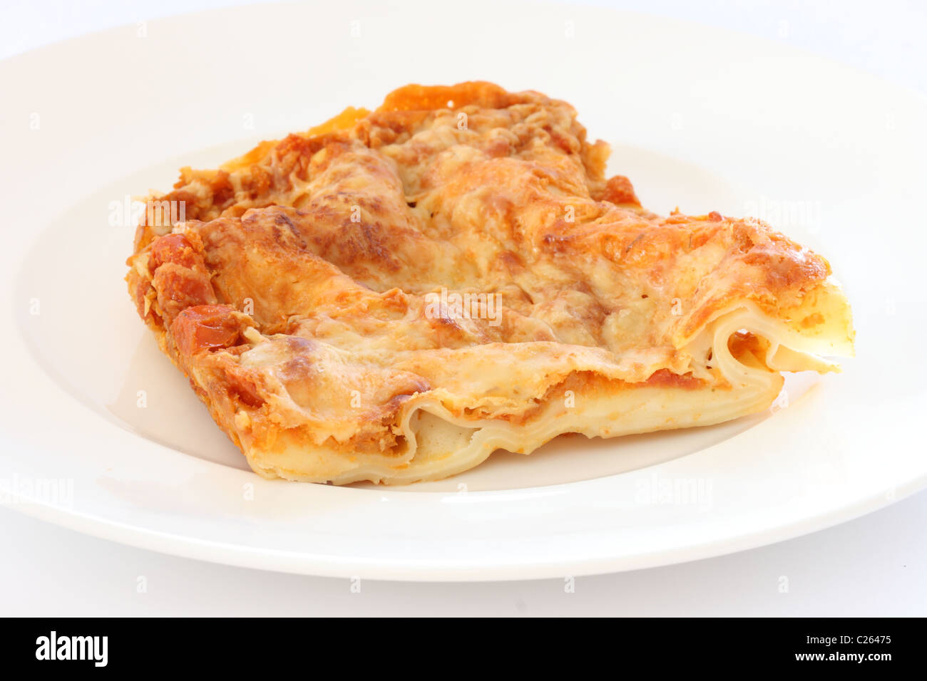 Detail of portion of lasagne noodles on whie plate Stock Photo Alamy