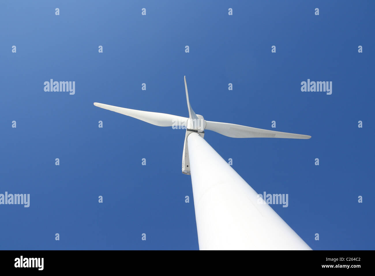 View of single windmill generating electricity against blue sky Stock ...