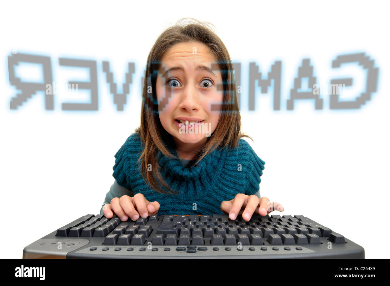 Stressed young girl in front of a computer screen with the words "game