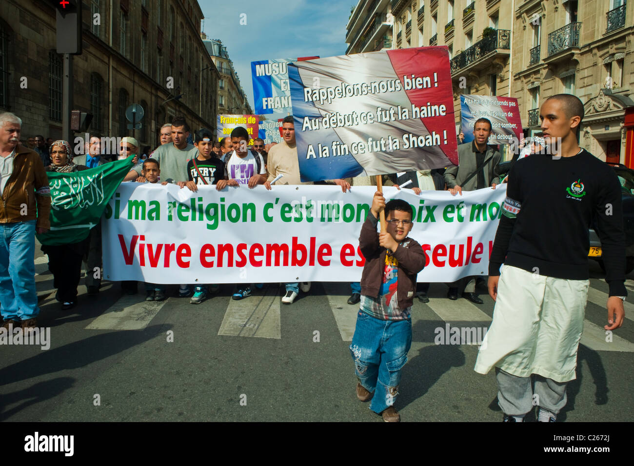 Paris, France, Muslim Groups Demonstrating Against Islamophobie, Banner, Young Boy Holding Protest sign on Street anti discrimination Stock Photo