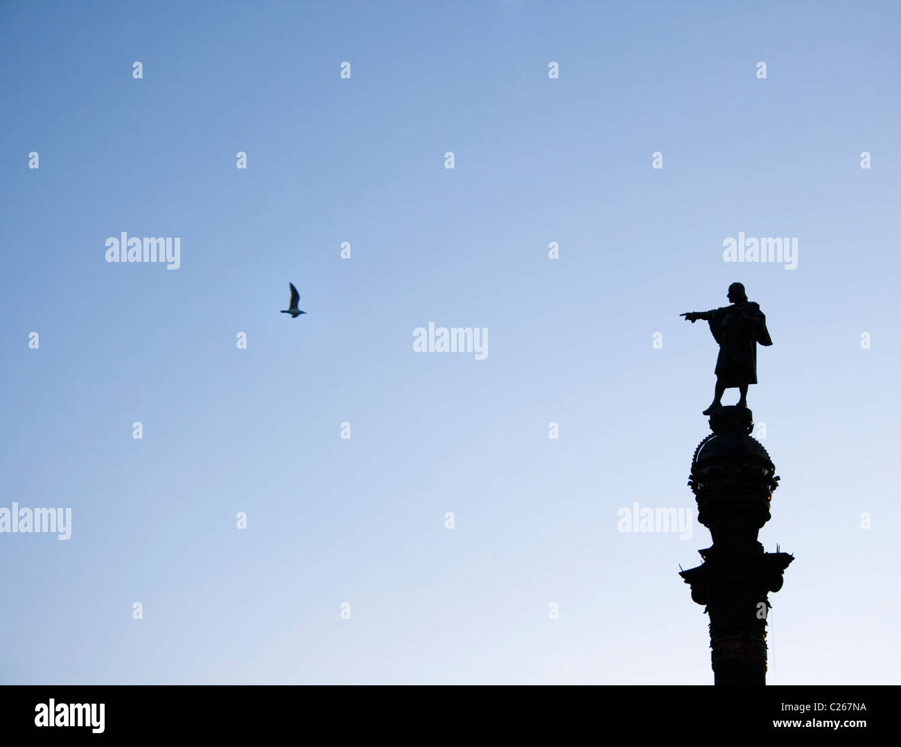 Barcelona, Spain. Silhouette of The Columbus Monument. Columbus appears to be pointing at a seagull. Stock Photo