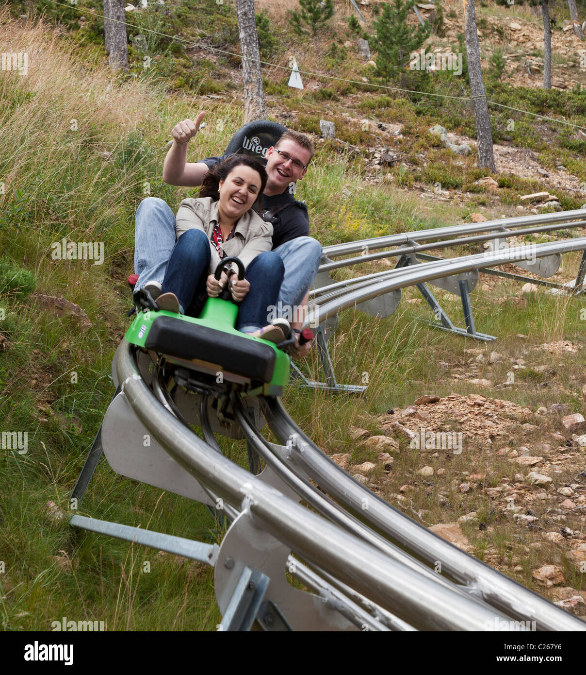 Two people on toboggan ride Naturlandia ecopark adventure park