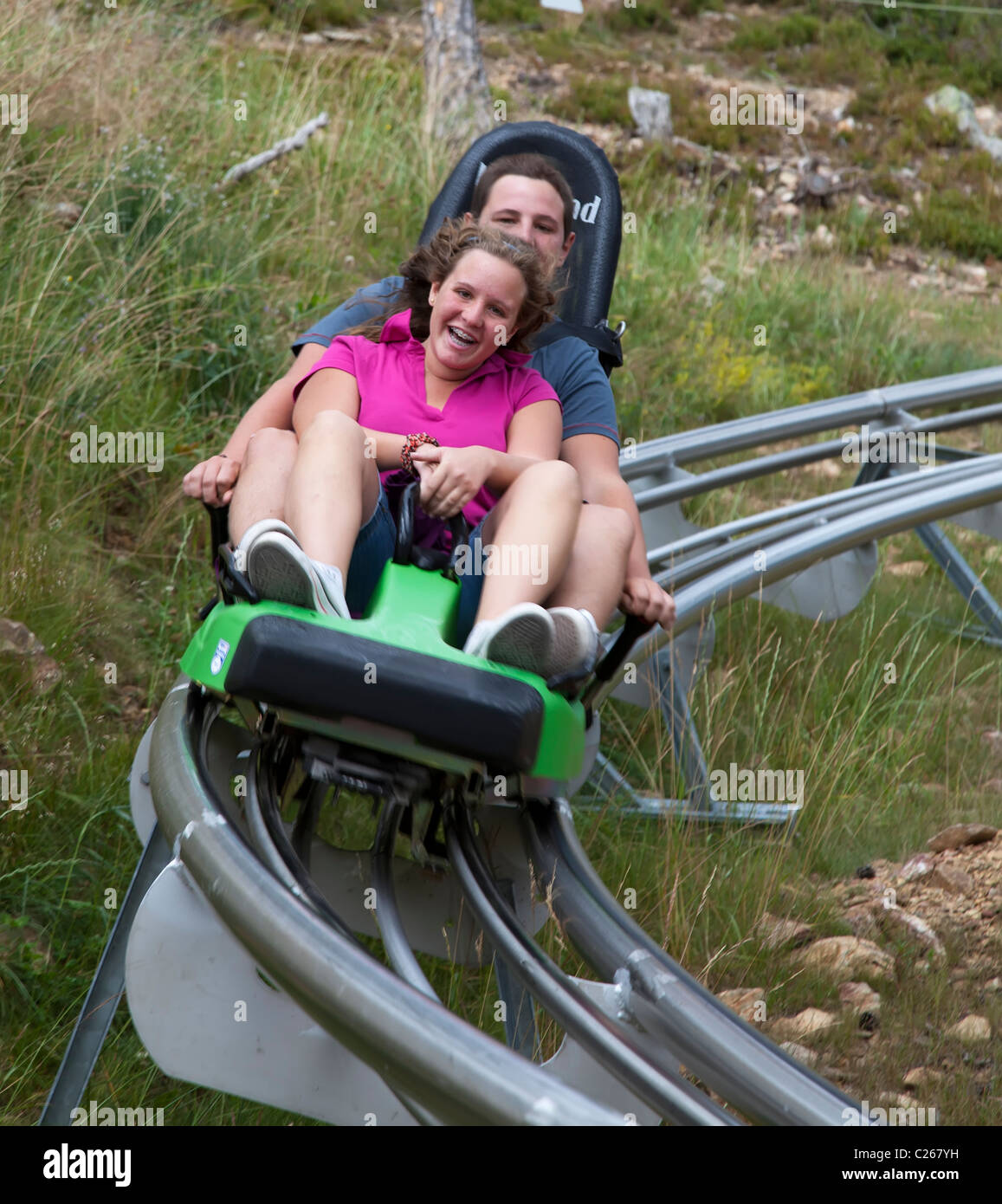 Two people on toboggan ride Naturlandia ecopark adventure park
