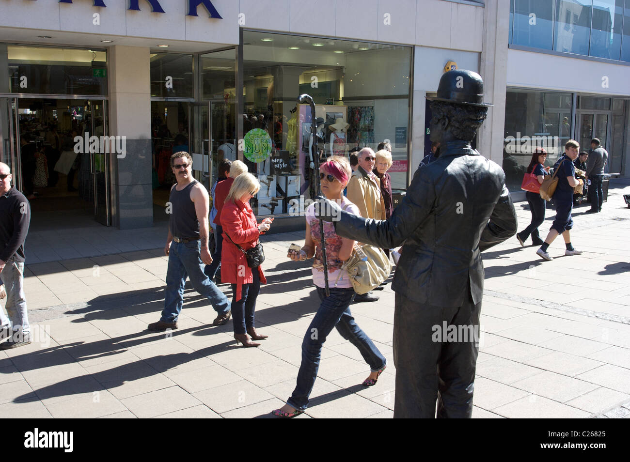 Charlie Chaplin,street performance,busking,statue,human activity,social interact,Norwich,Norfolk,UK Stock Photo