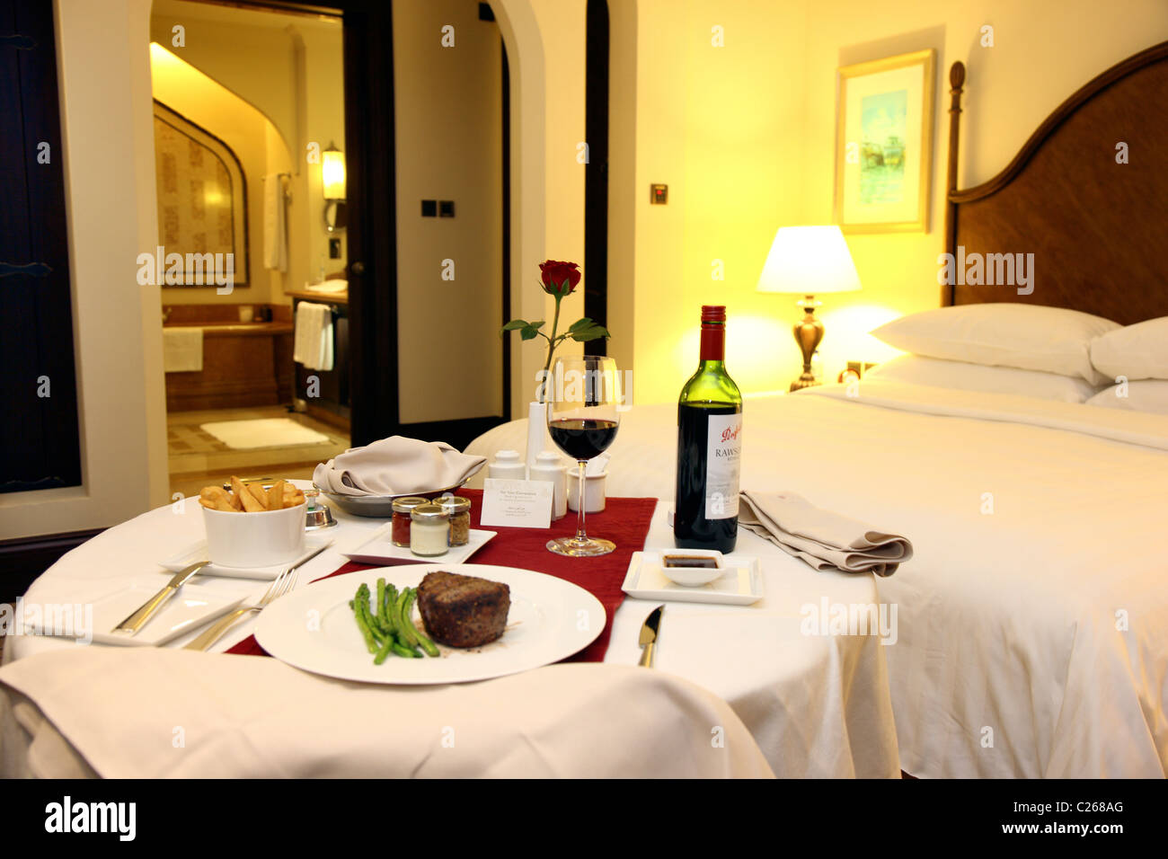 In room dining in a hotel room. Meal service. Shangri-La Hotel Qaryat Al Beri Abu Dhabi, United Arab Emirates. Stock Photo