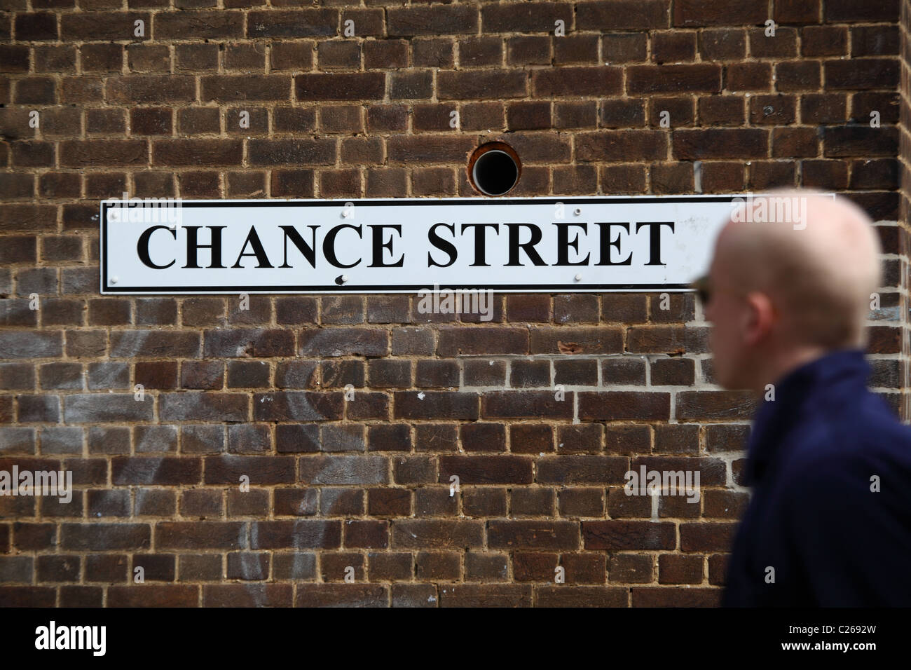 man passing by chance street in London UK E1 Stock Photo