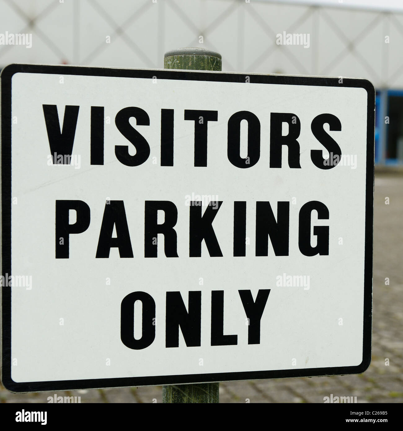 A Visitors Parking Only sign outside a factory in Worthing, West Sussex Stock Photo Alamy