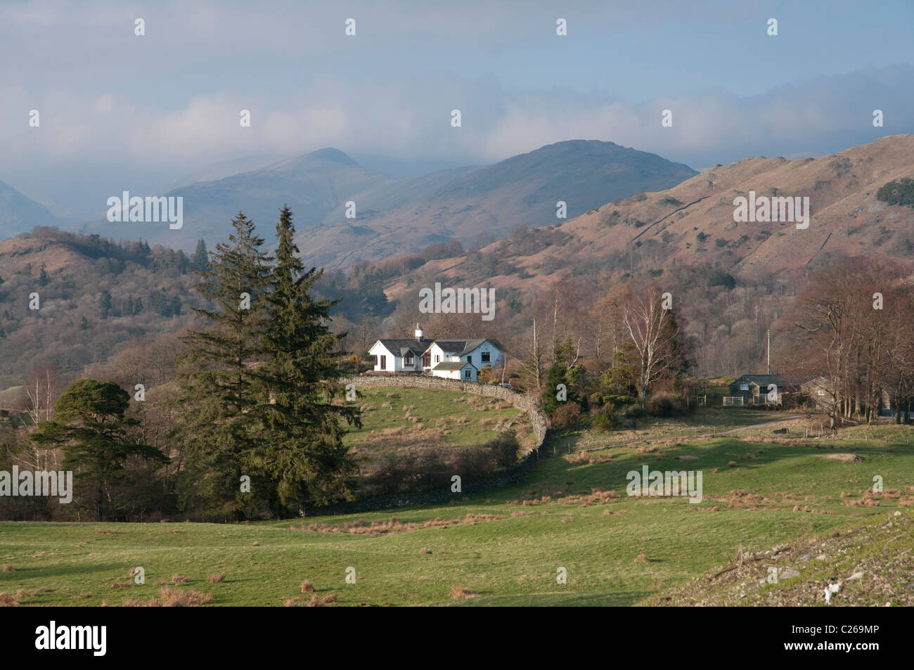Looking over the cottage at Low Park,  Skelwith Bridge in the Lake District towards the mountains of Heron Pike and Great Rigg Stock Photo
