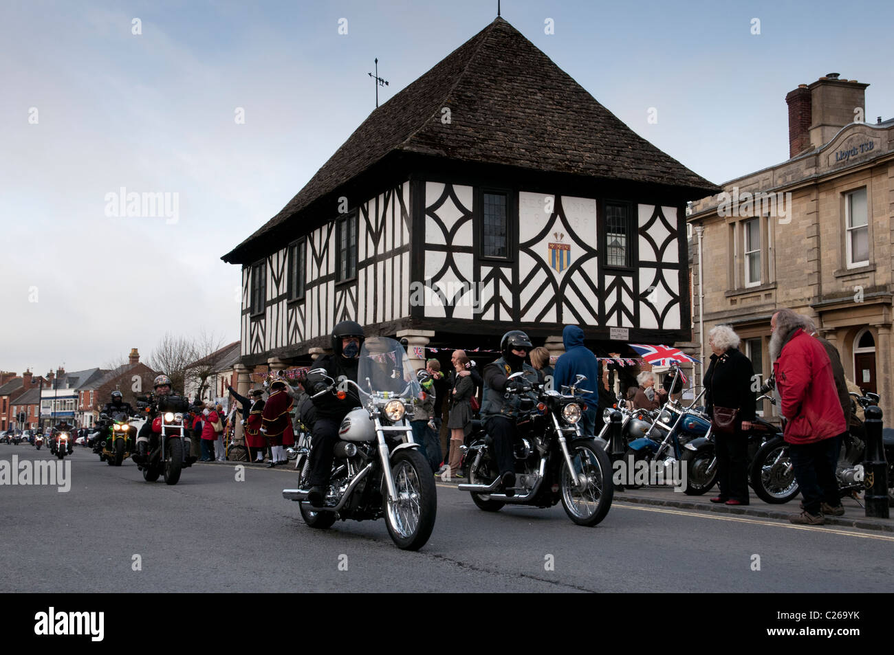 Motorcyclists taking part in the Ride of Respect Charity Event ride their bikes in Wooton Bassett High Street Stock Photo