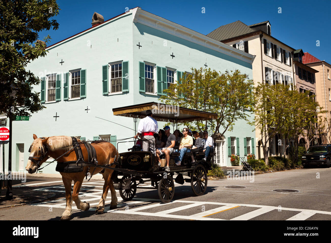 Historic home on Rainbow Row and horse carriage tour in Charleston, SC. Stock Photo