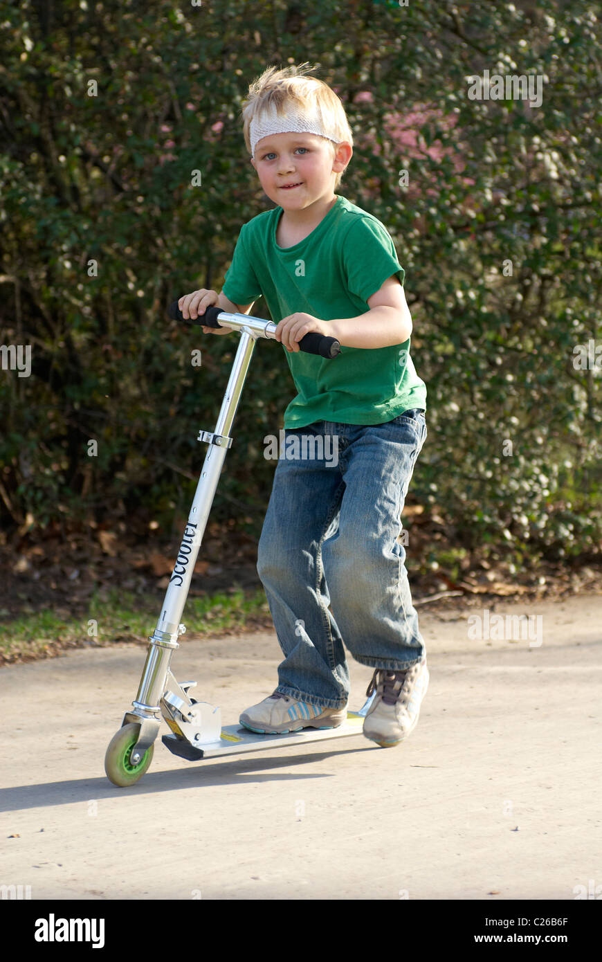 child on scooter