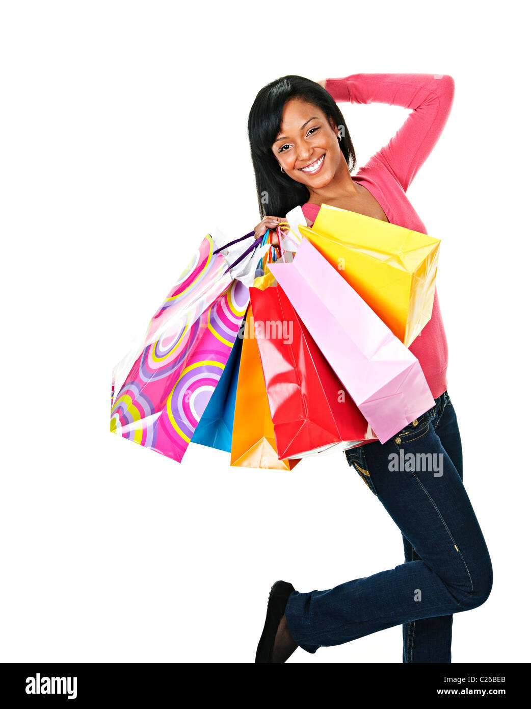Young excited smiling black woman holding shopping bags Stock Photo - Alamy