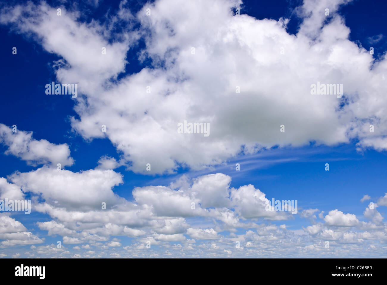 Background of blue sky with white cumulus clouds Stock Photo