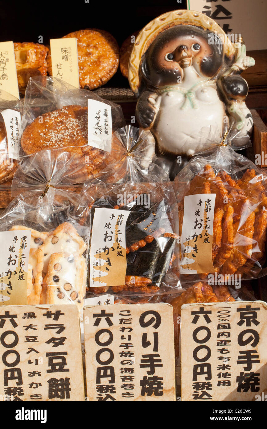 Shop on Ninen-zaka selling sembe (rice crackers), with ceramic tanuki (raccoon dog), in Kyoto, Japan. Stock Photo