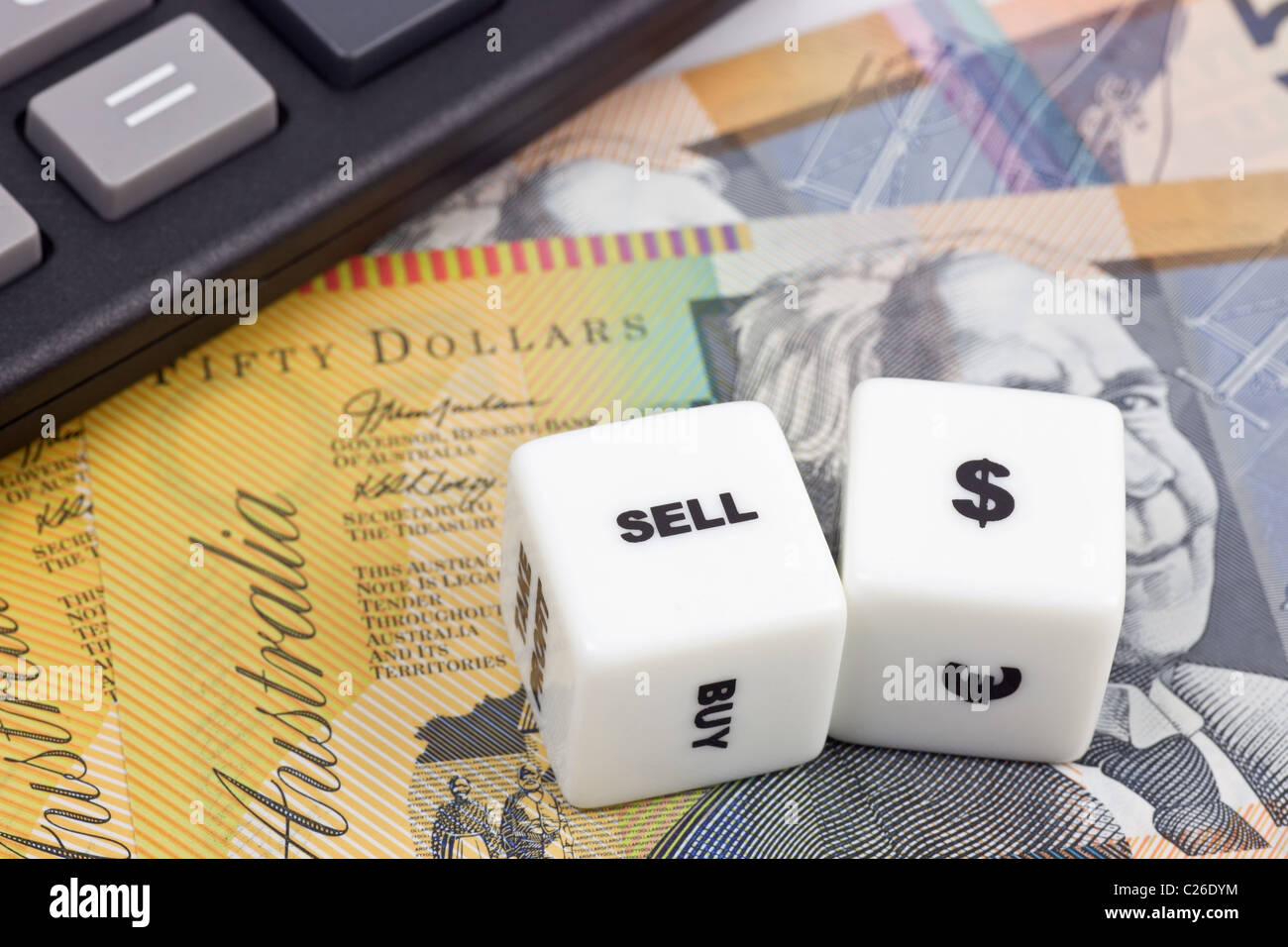 Australian currency with calculator and dice showing SELL Stock Photo