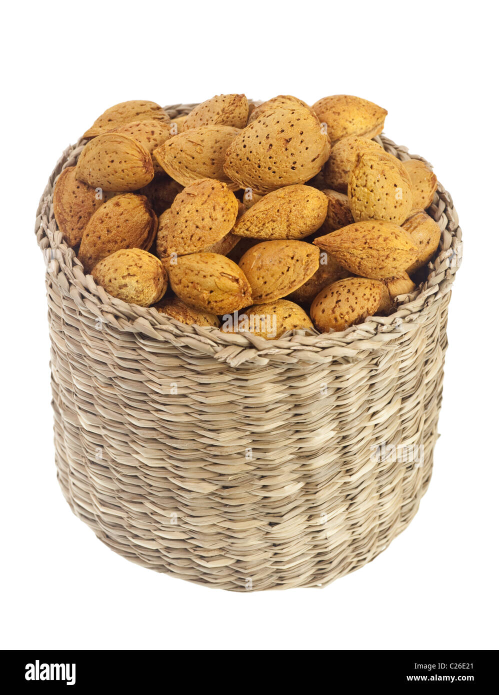 Basket of unshelled almonds isolated on white background Stock Photo