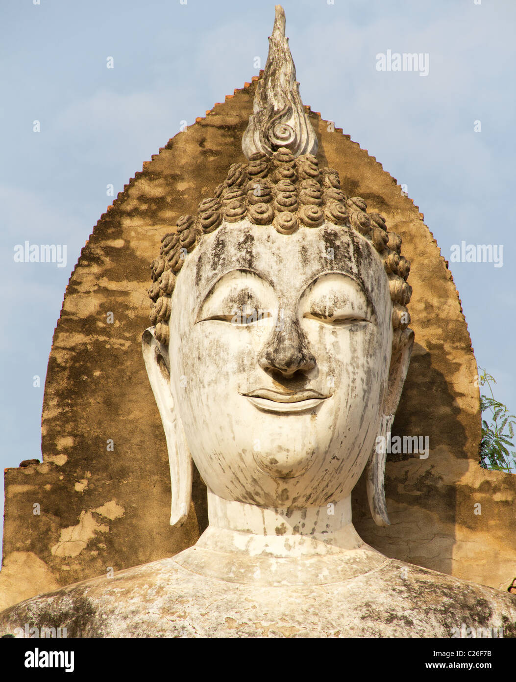 Face of Tall Standing Buddha Statue at Wat Mahathat, Sukothai Historical Park, Thailand Stock Photo