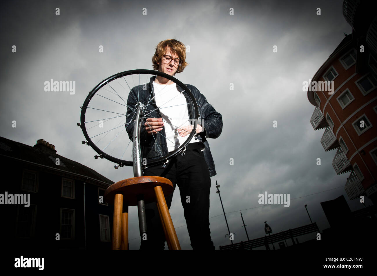 Aberystywyth university art student JOE SCOTT with his kinetic sculpture based on a bicycle wheel, Stock Photo