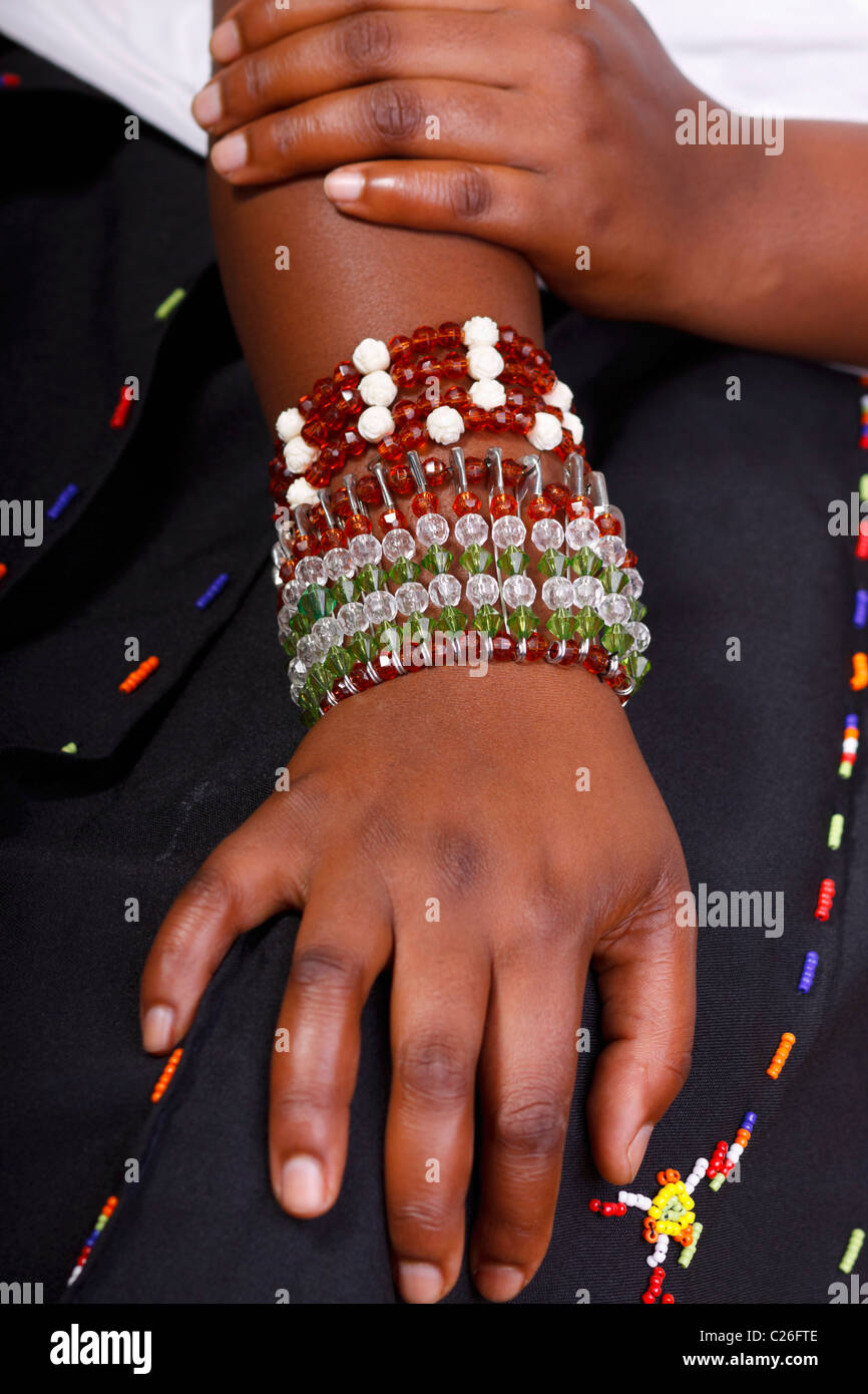 A young woman wearing modern Zulu beaded bracelets known as izingusha. South Africa. Stock Photo