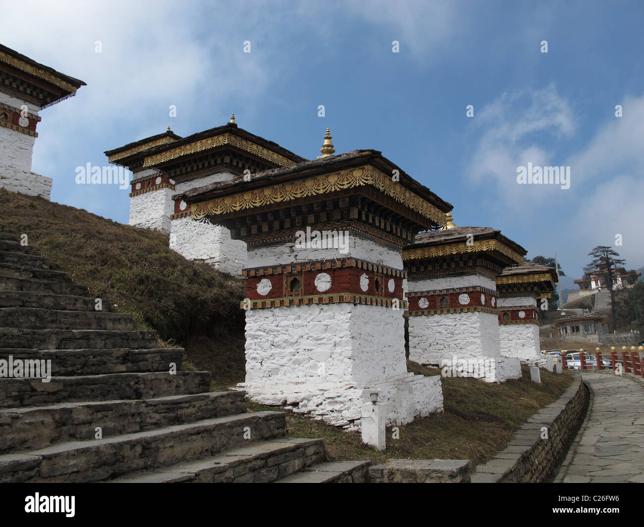 Stupas at Dochula Pass with the monastery in the background, Bhutan Stock Photo