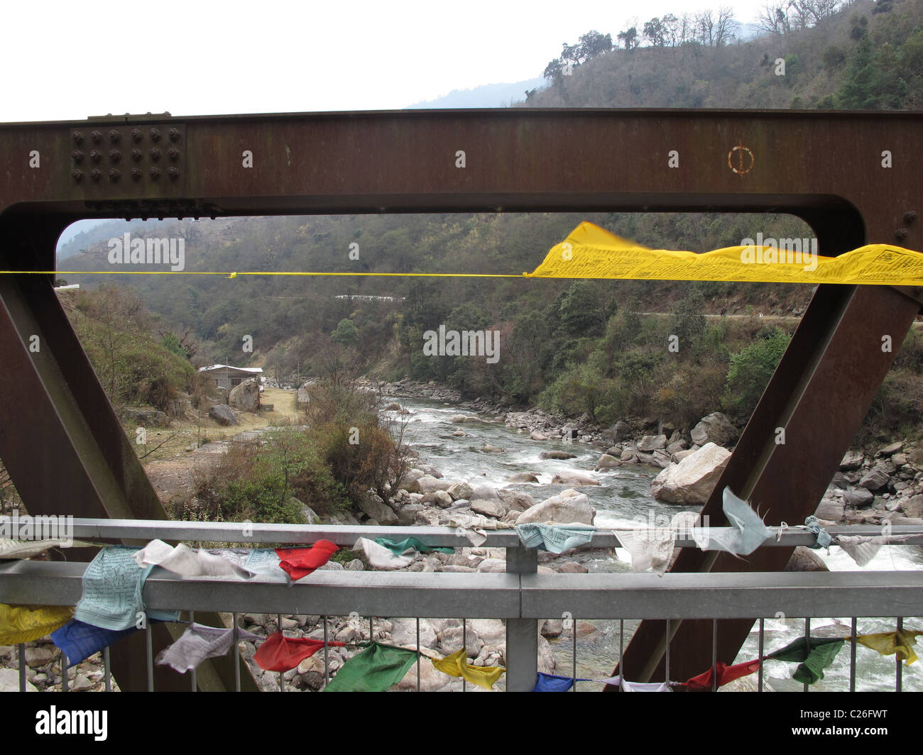 Bridge with prayer flags over the Mangde Chu (river) near Trongsa, Bhutan Stock Photo