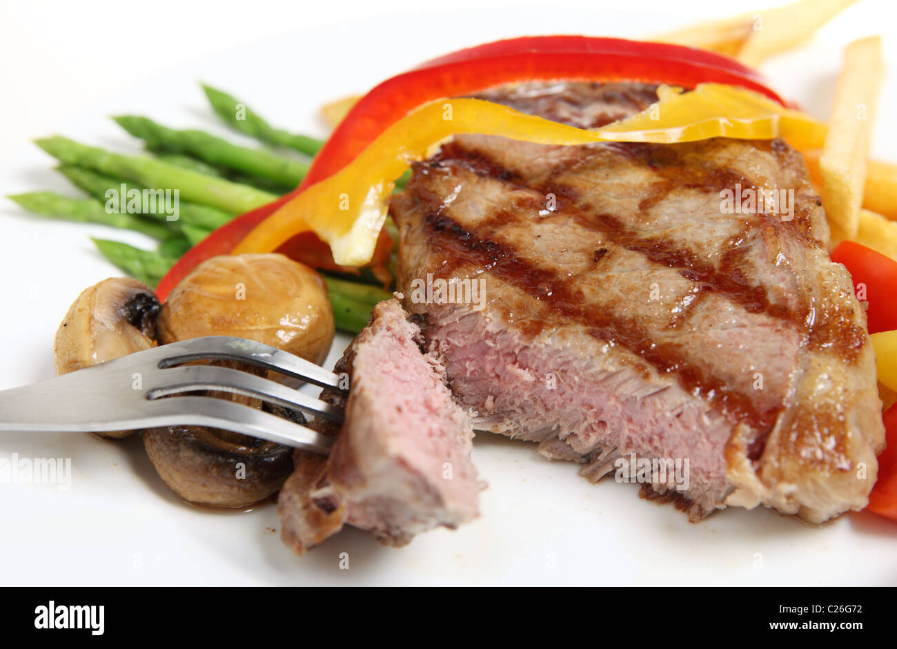 A perfectly cooked veal sirloin steak sliced open and served with