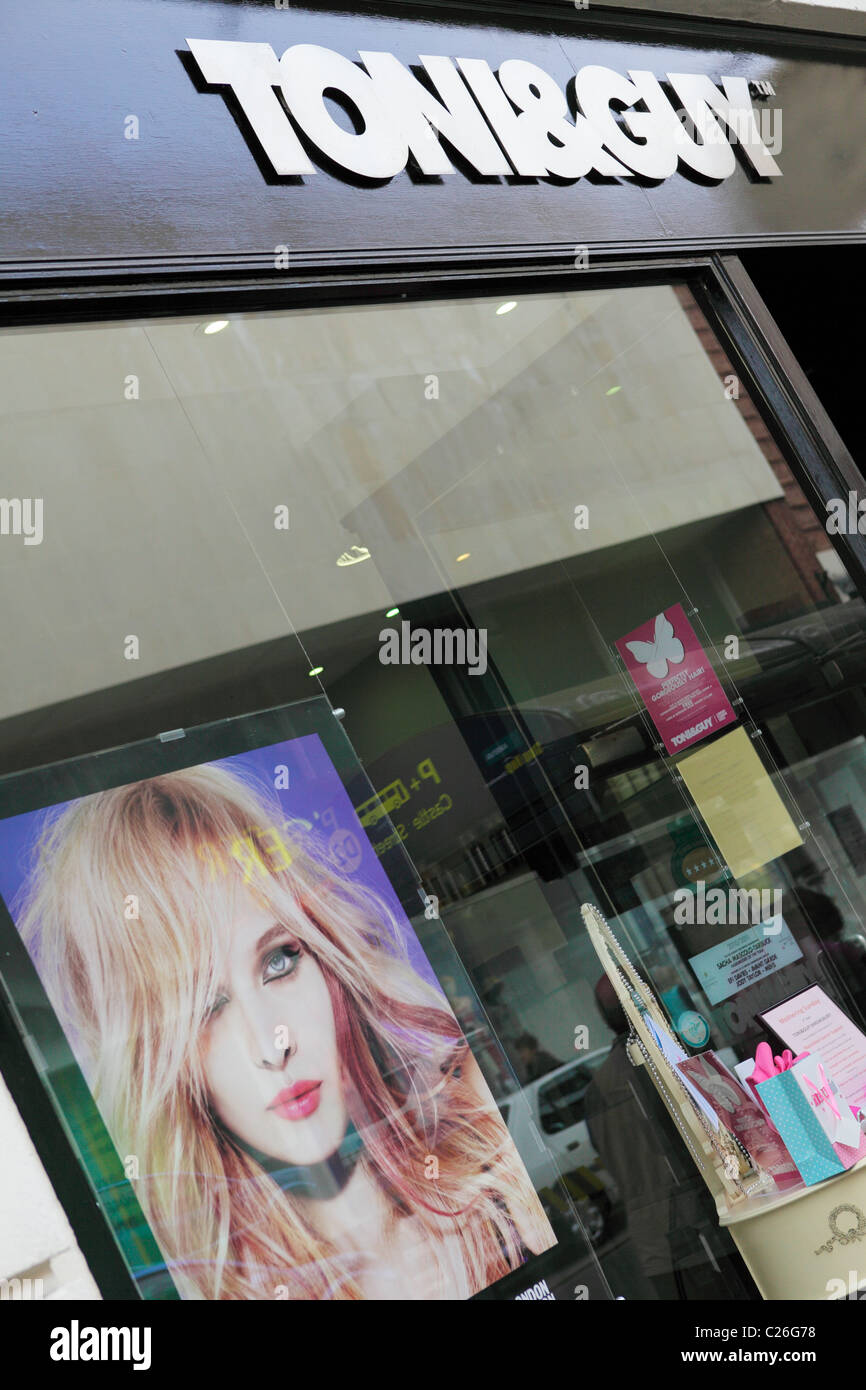 TONI & GUY, popular high street hairdressers and beauticians, viewed here is the company name, viewed at an angled aspect. Stock Photo