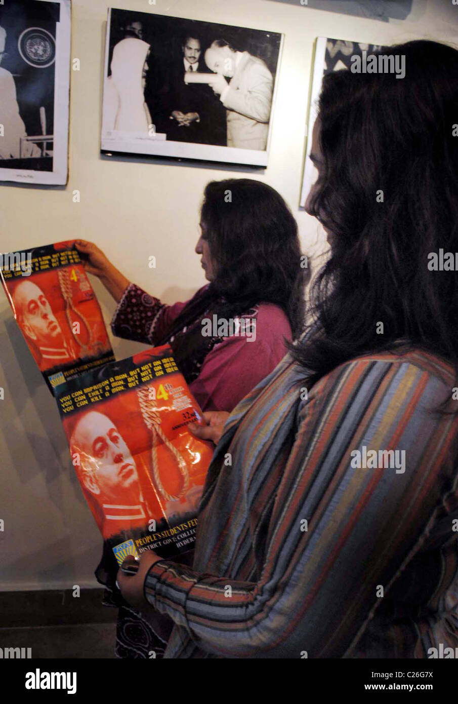 Women take keen interest in pictures of Zulfiqar Ali Bhutto Founder of Peoples Party (PPP) during an exhibition Stock Photo