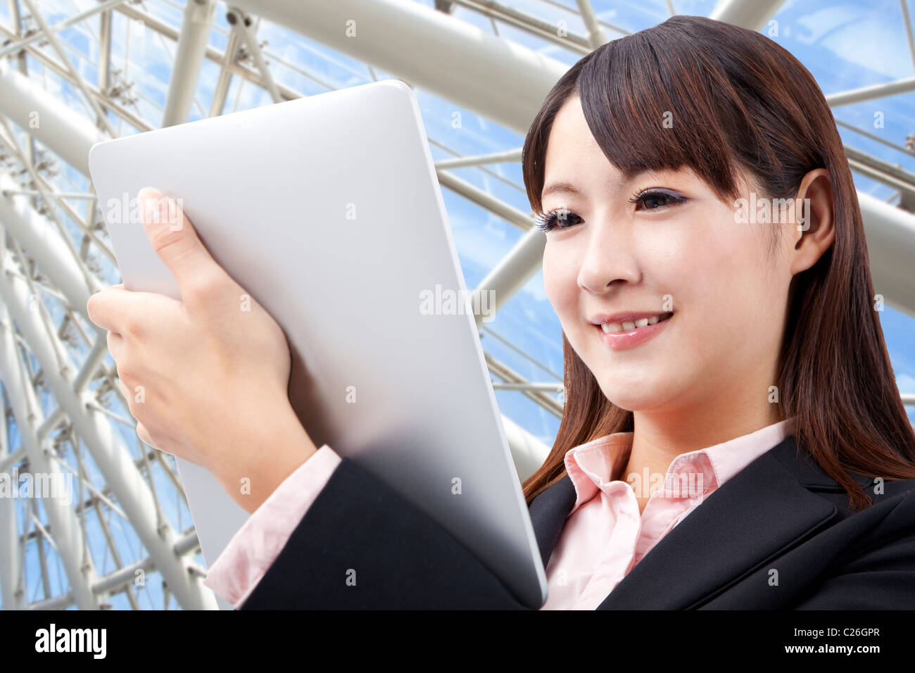 Business woman watching touch pad in the modern office Stock Photo Alamy