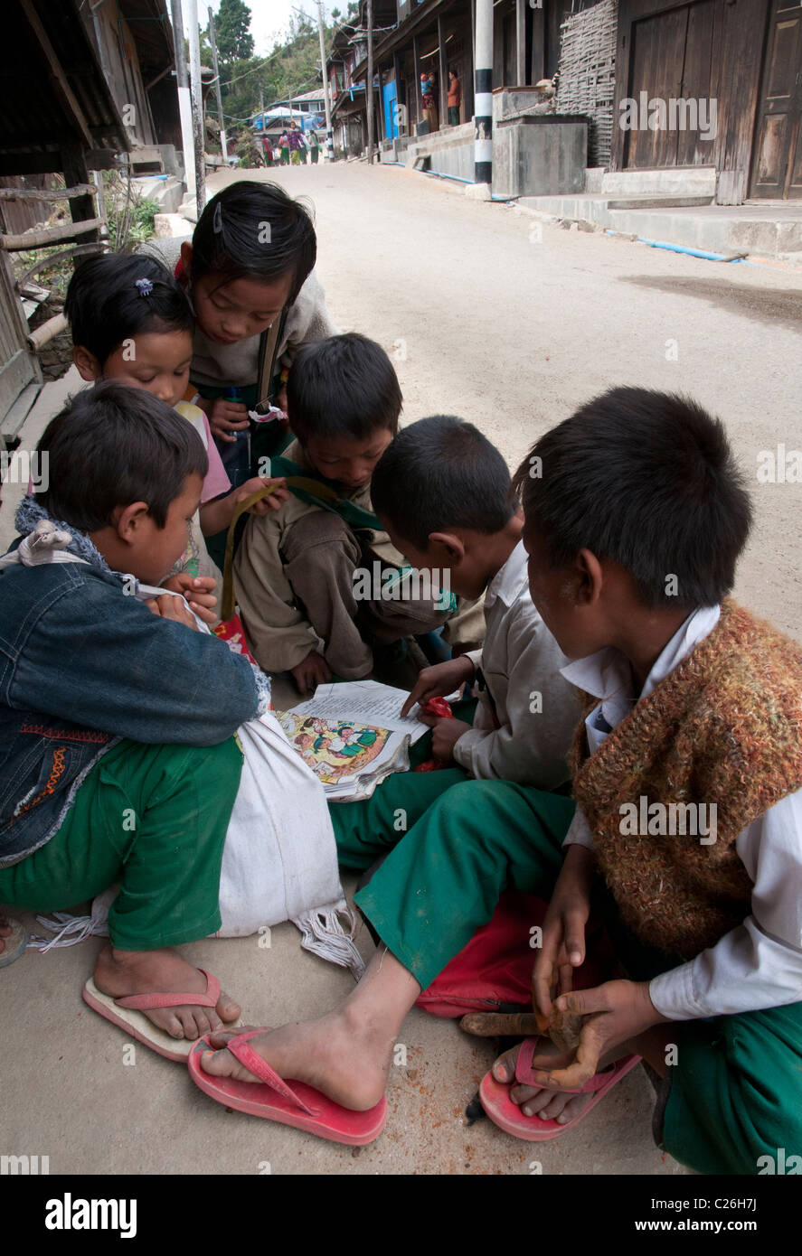 group of children reading. Nahmsan town. Northern Shan State.  Myanmar Stock Photo