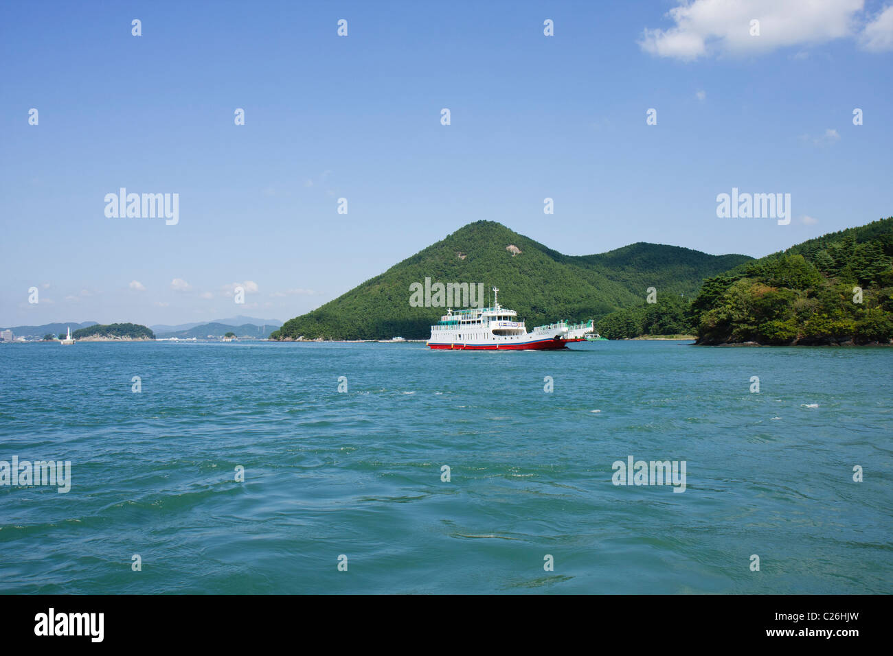 Excursion boat sailing into Hansan Island harbor, South Korea Stock Photo
