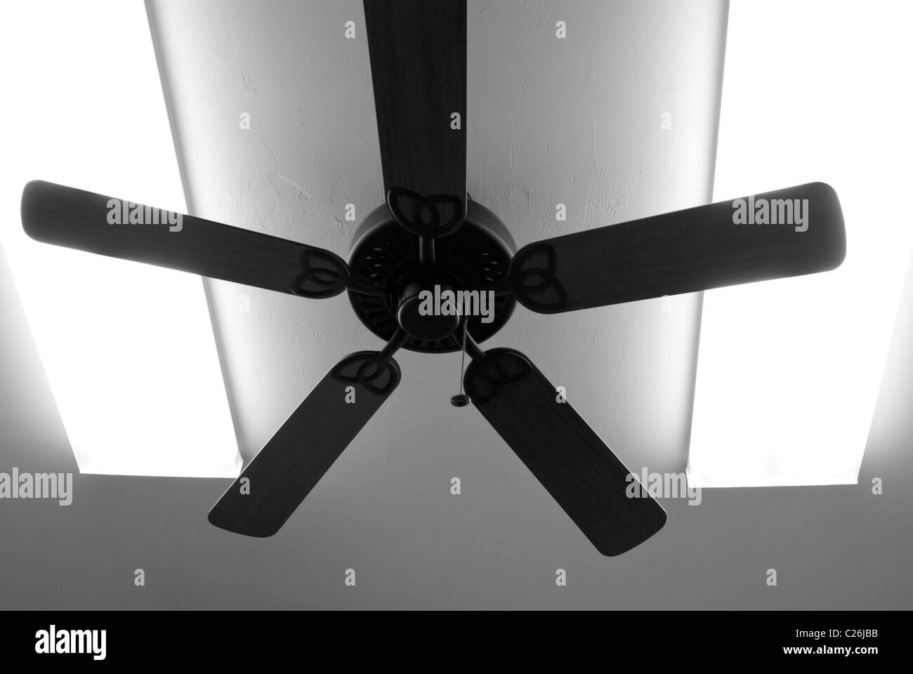 ceiling fan and overhead fluorescent light panels Stock Photo Alamy