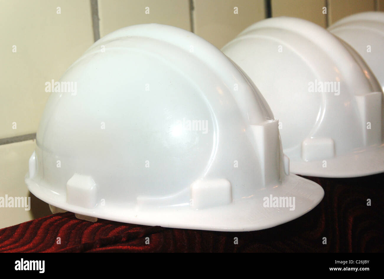 Helmets on bench for head protection Stock Photo Alamy